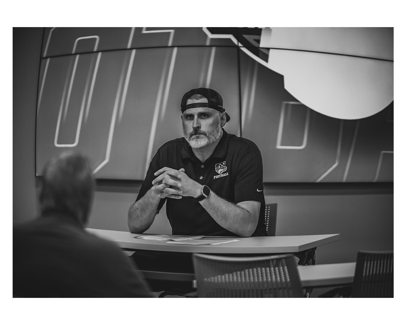 Nate Garner in a recruiting meeting room, black and white